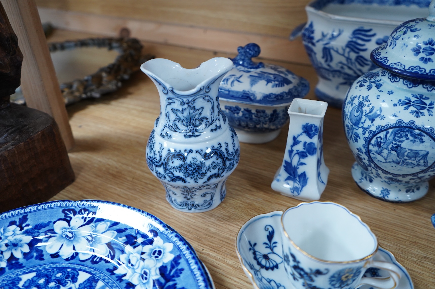 A group of blue and white Willow pattern china, 19th century and later and a Meissen cup and. Saucer. (12).